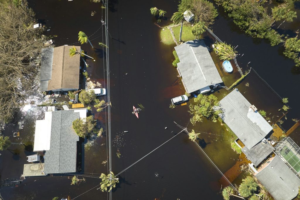 Hurricane Ian flooded houses in Florida residential area. Natural disaster and its consequences